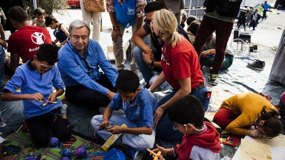 The UN's new secretary-general Antonio Guterres with Red Cross workers at a refugee camp