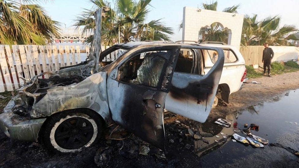 A destroyed vehicle in Gaza