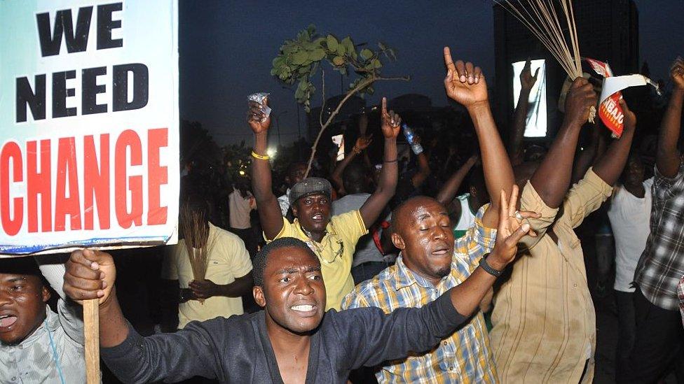 Youths celebrate on March 31, 2015 the victory of main opposition All Progressives Congress (APC) presidential candidate Muhammadu Buhari in Abuja