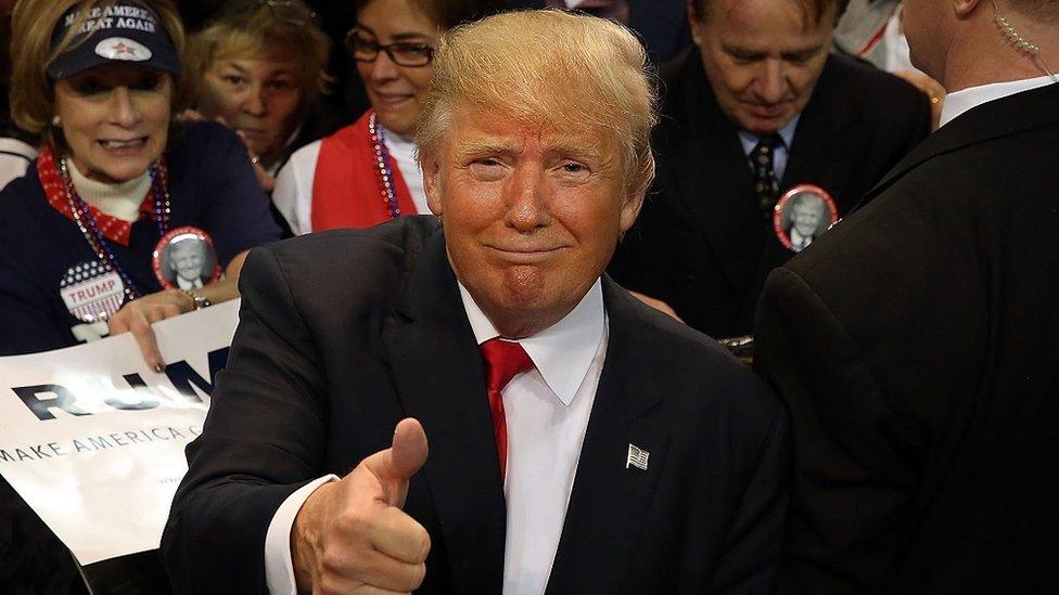 Donald Trump gives a thumbs-up at a rally in Biloxi, Mississippi.