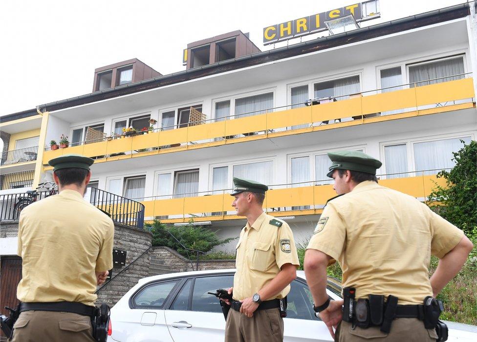 Police outside the former hotel where the bomber had lived in Ansbach, Germany, 25 July