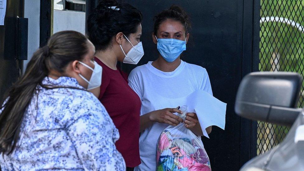 Sara Rogel talks to relatives after being released from the Zacatecoluca Penal Center in Zacatecoluca, El Salvador