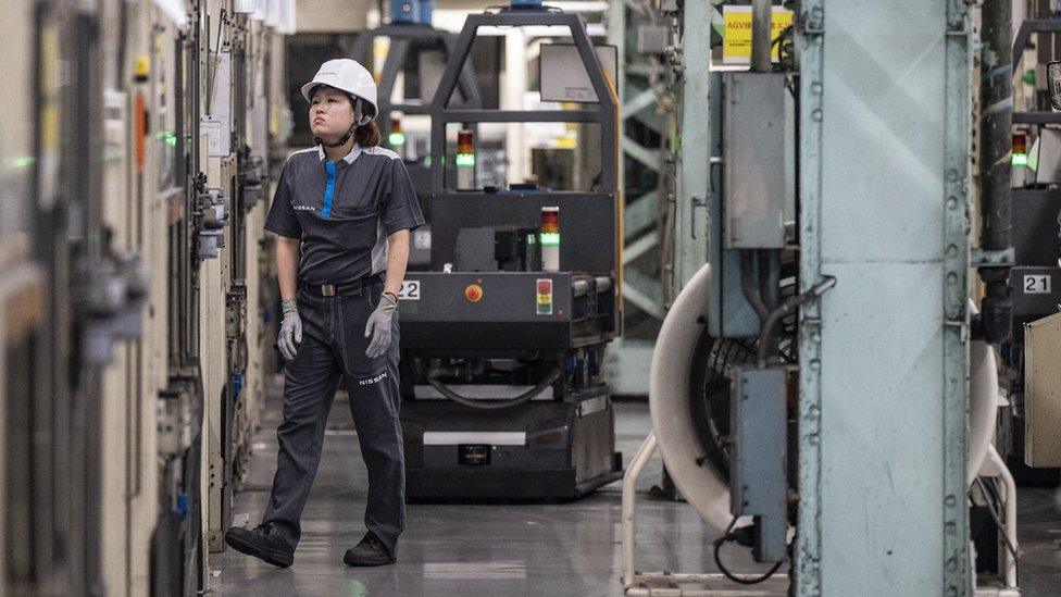 A worker at a Nissan factory in Yokohama, Japan.