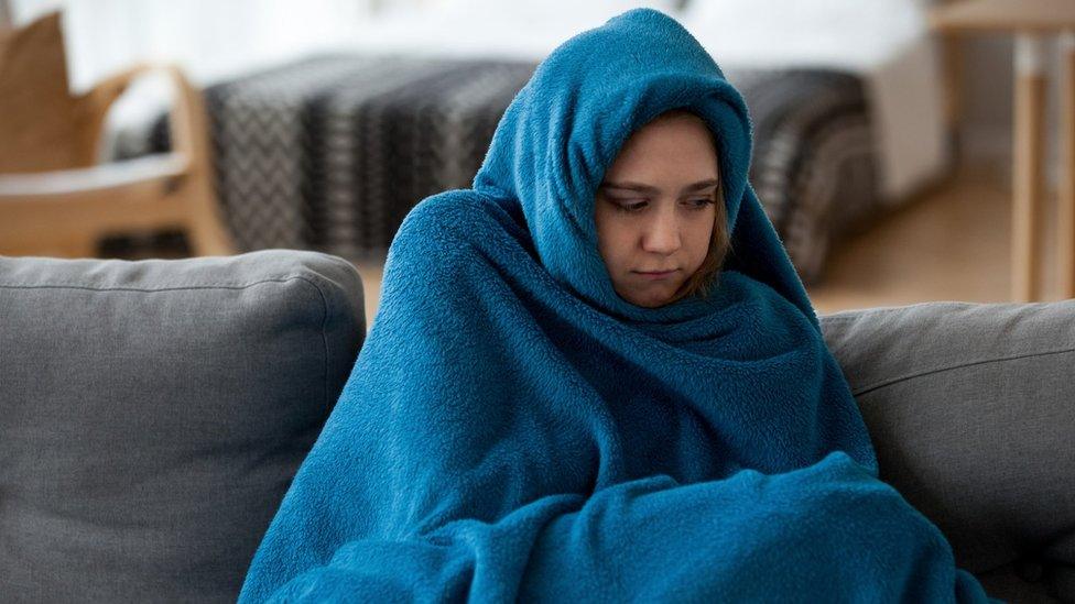 Woman wrapped in a blanket