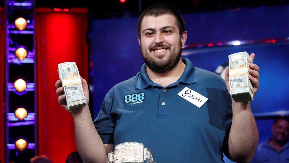 Scott Blumstein posing with bank notes