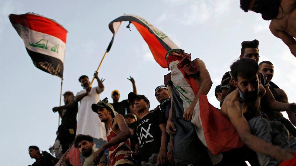 Iraqis gather to mark the first anniversary of the start of anti-government protests in Baghdad, Iraq (25 October 2020)