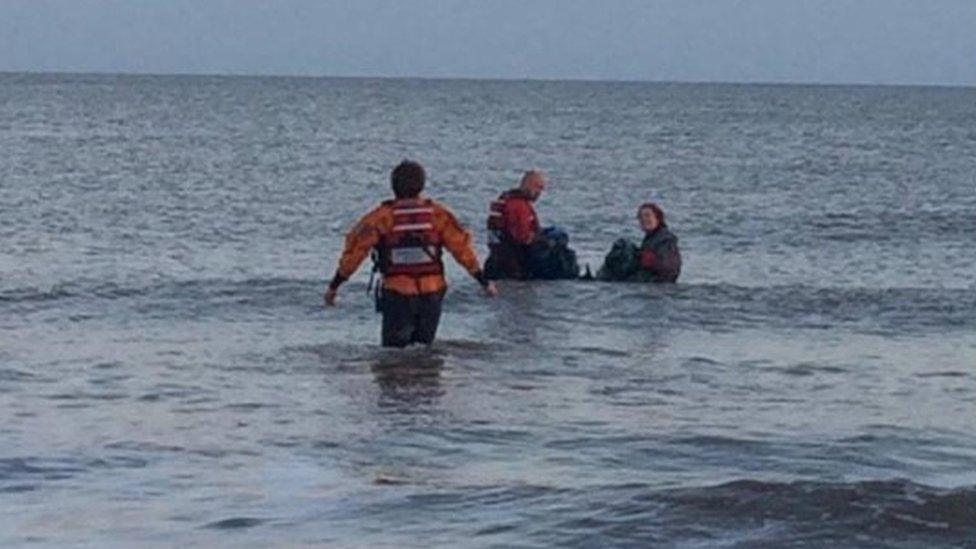 Divers and the coastguard rescuing the porpoise on Saturday