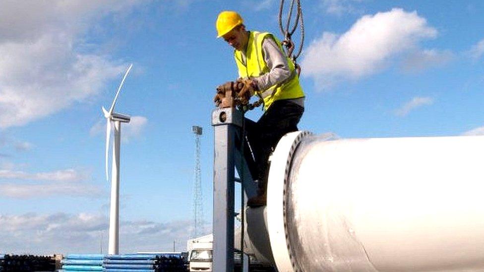 worker unloading wind power parts