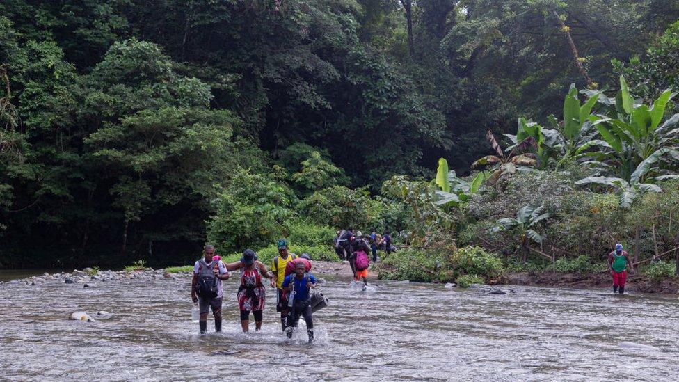 Haitian migrants crossing the Panama-Colombia border