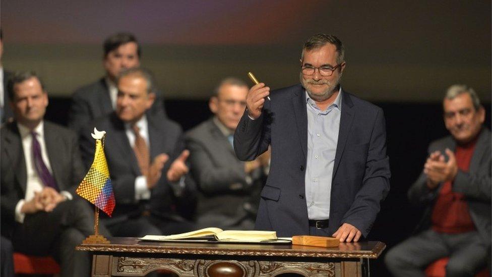 Head of the FARC guerrilla Timoleon Jimenez, aka Timochenko, gets ready to sign the historic peace agreement between the Colombian government and the Revolutionary Armed Forces of Colombia (FARC), at the Colon Theater in Bogota, Colombia, on November 24, 2016