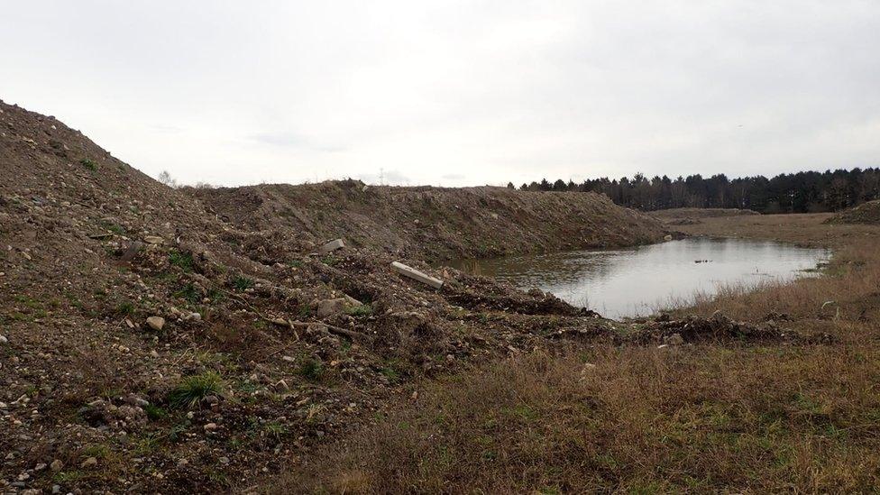 The soil piled up next to a pool of water