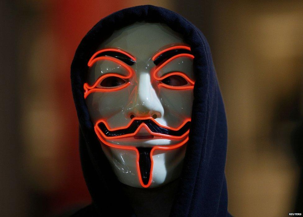 A supporter of the activist group Anonymous wears a mask during a protest in London on 5 November