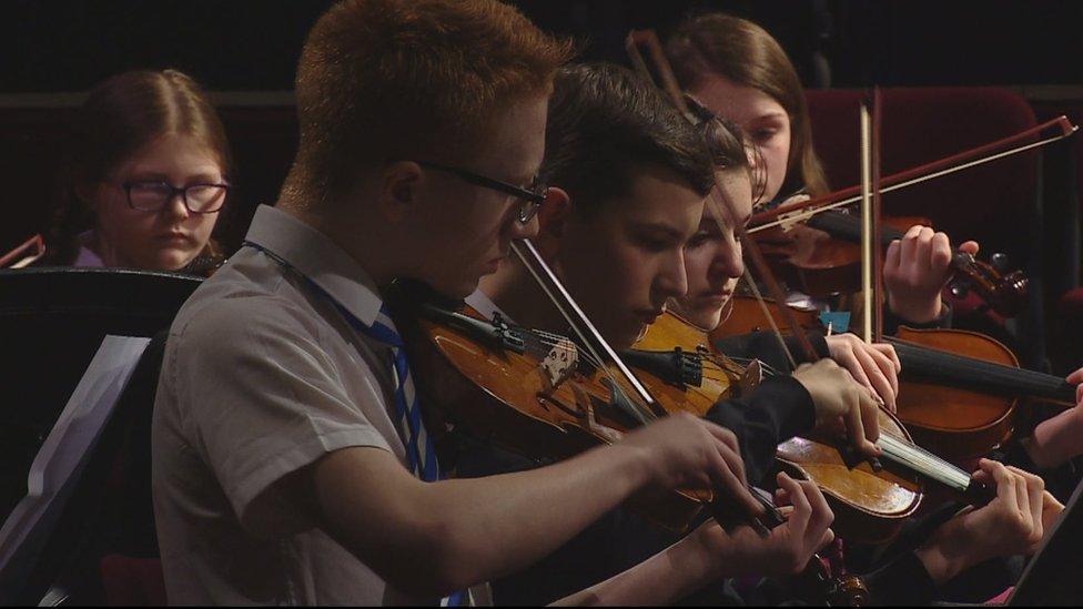 Pupils playing instruments