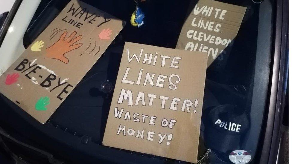 Protest banners in a car dashboard