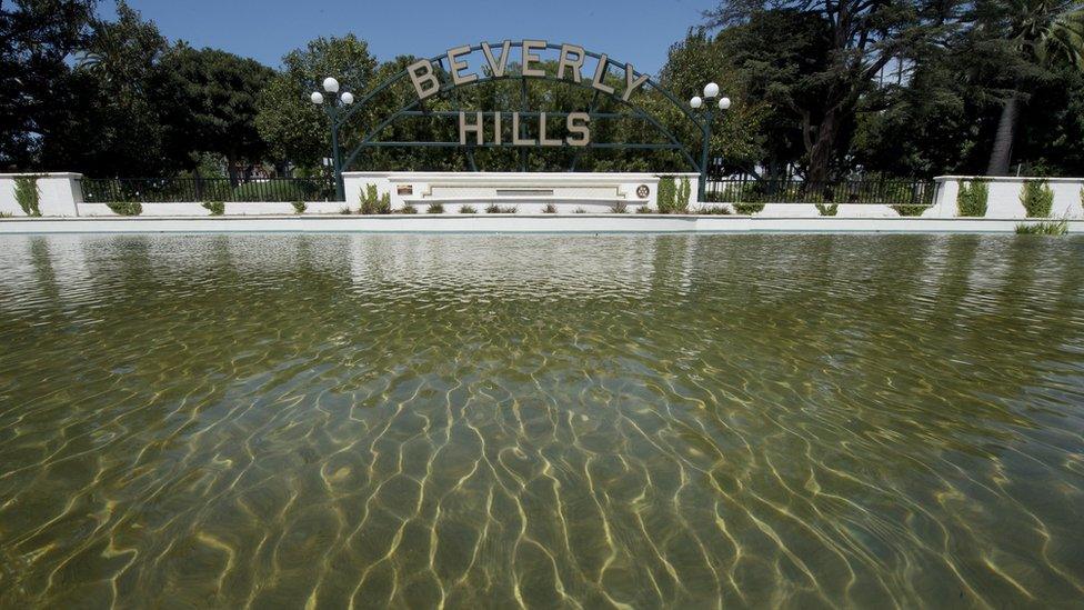 The Beverly Hills lily pond with the city's famous sign, 9 April 2015.