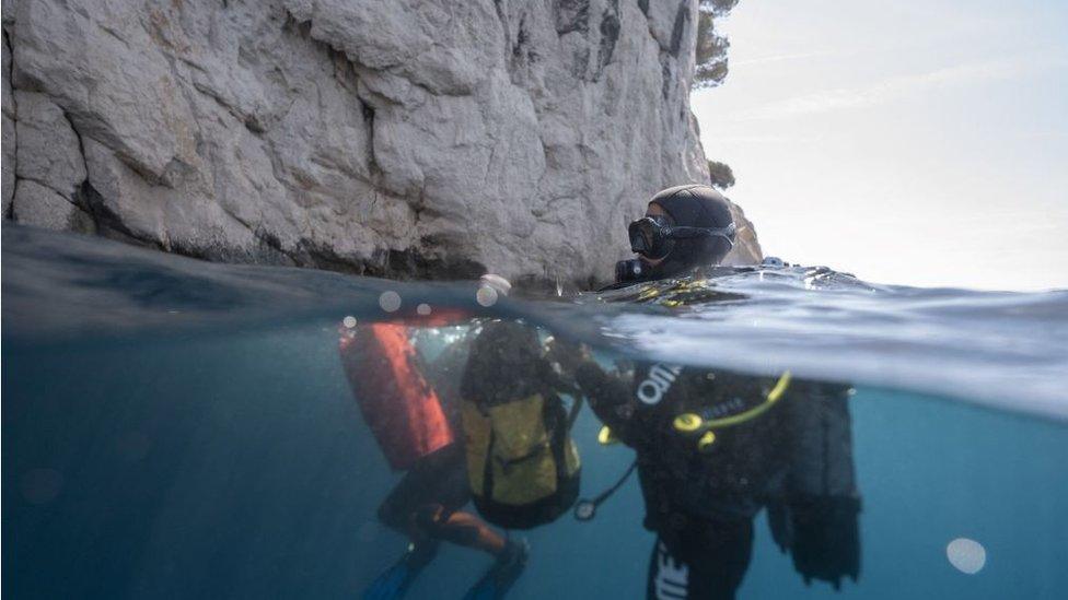 Diver getting ready to enter the cave