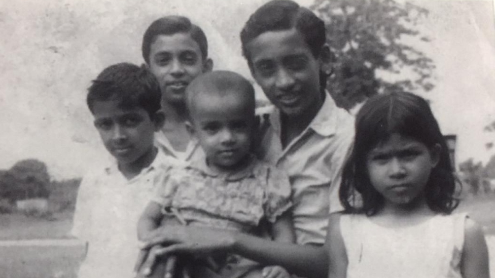 Mr Monir and four siblings in black-and-white photograph