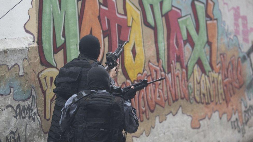 Police officers participate in an operation against alleged drug traffickers at Pavao Pavaozinho slum