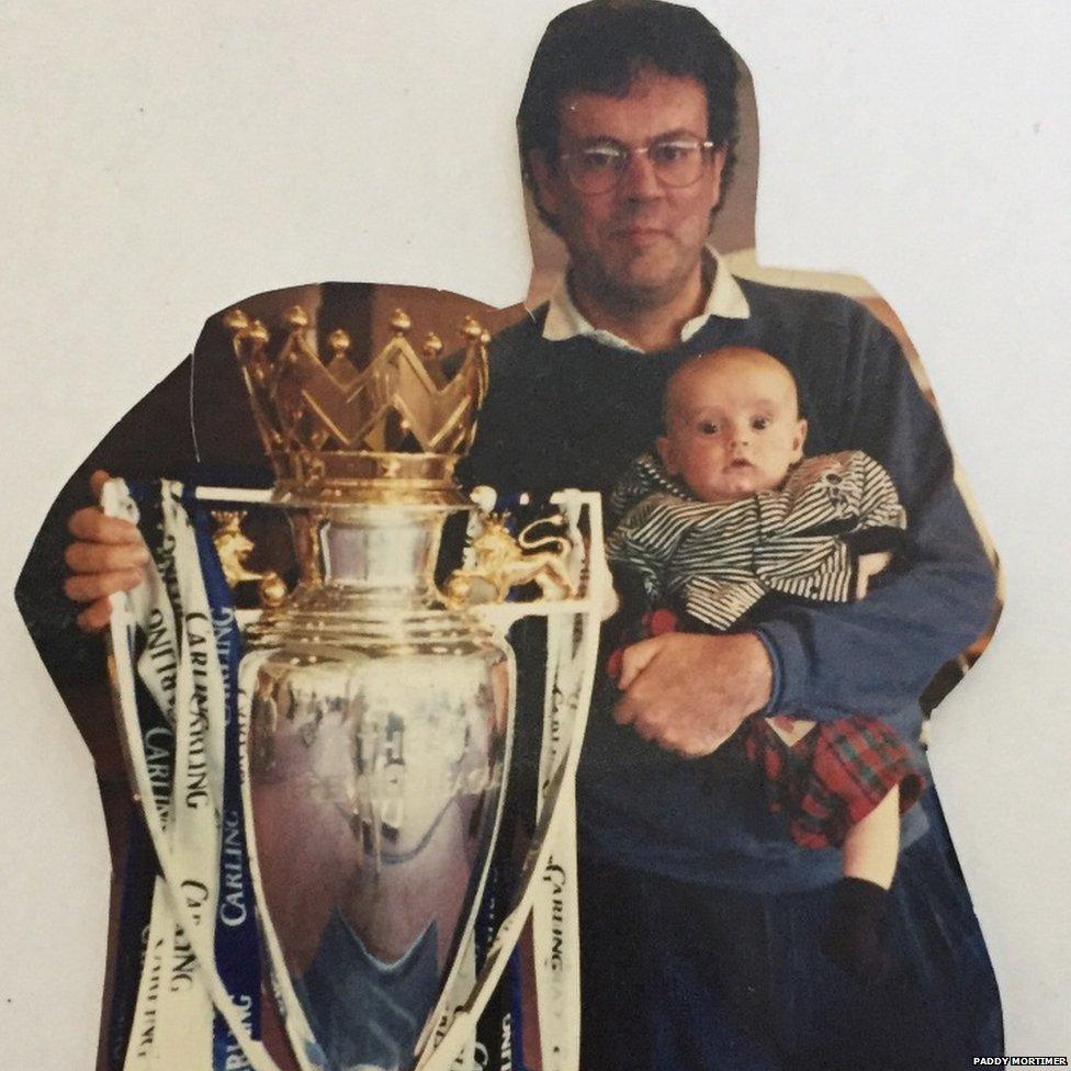 Paddy at two months old with the Premier League trophy.