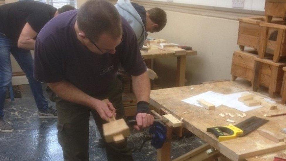 people working in workshop