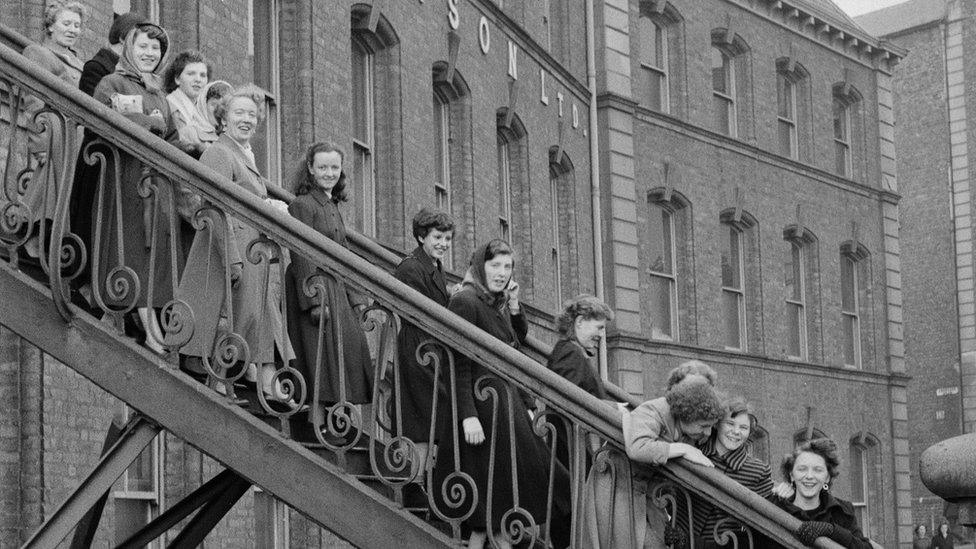 Workers leaving Tillie and Henderson's shirt factory in November 1955