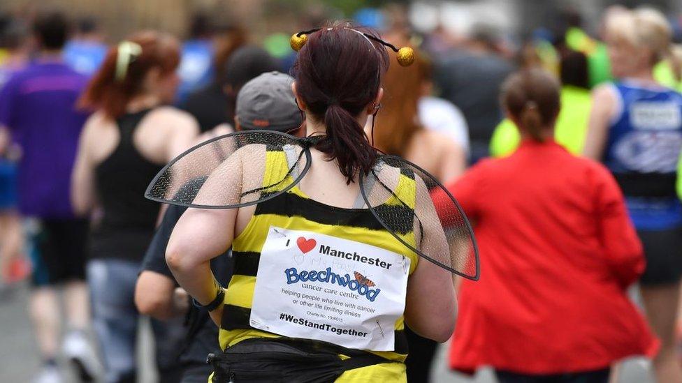 Fun runner wearing bee costume