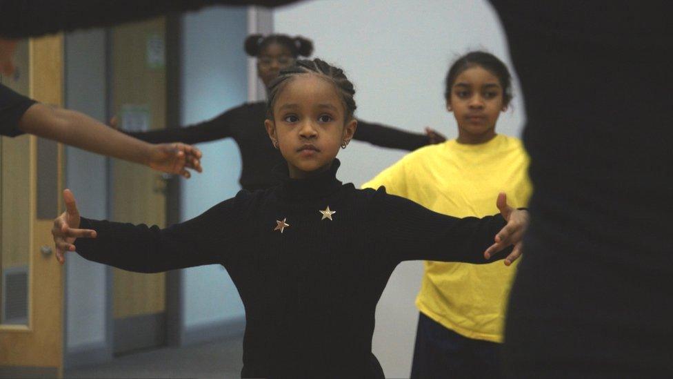 Young girl doing ballet pose