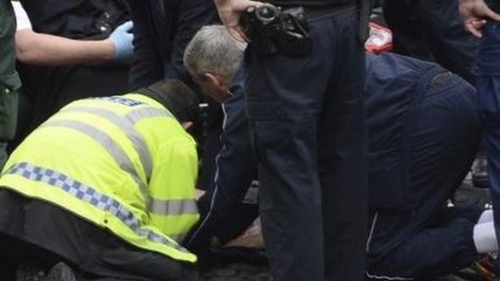 Tony Davis (kneeling in blue jacket) was among those who tried to resuscitate PC Palmer