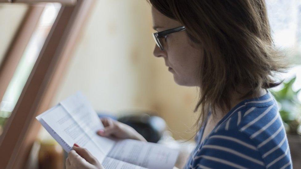 Woman reads official letter