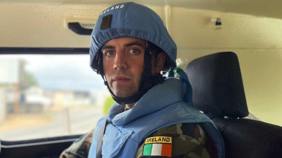 Captain Tony Smith sits in a vehicle