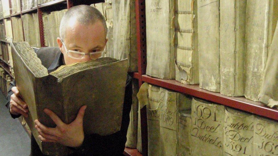 Man smelling a book