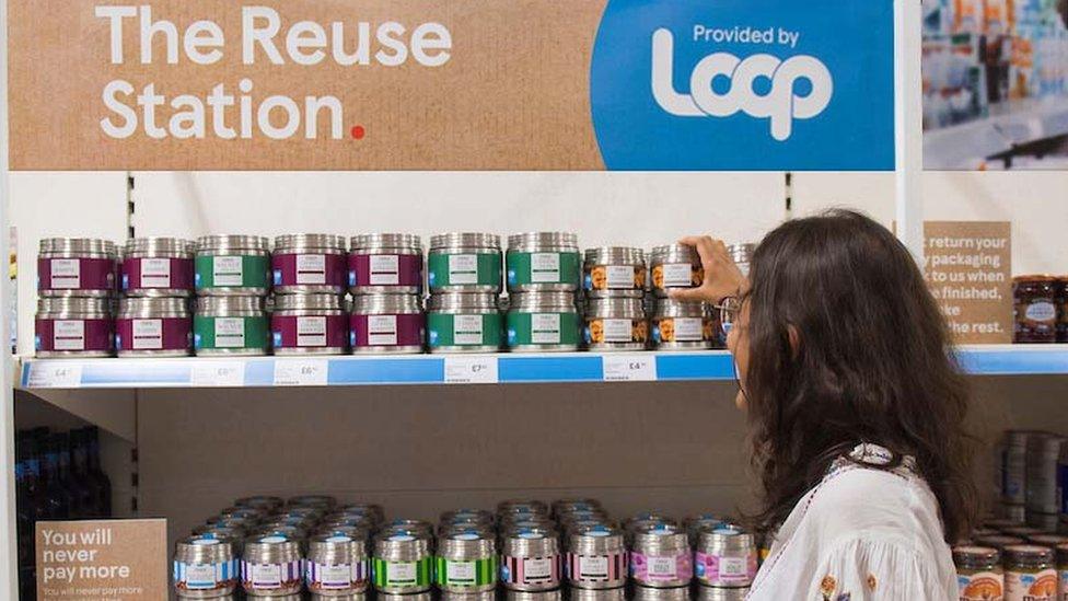 A shopper visiting the Loop section of a Tesco supermarket aisle