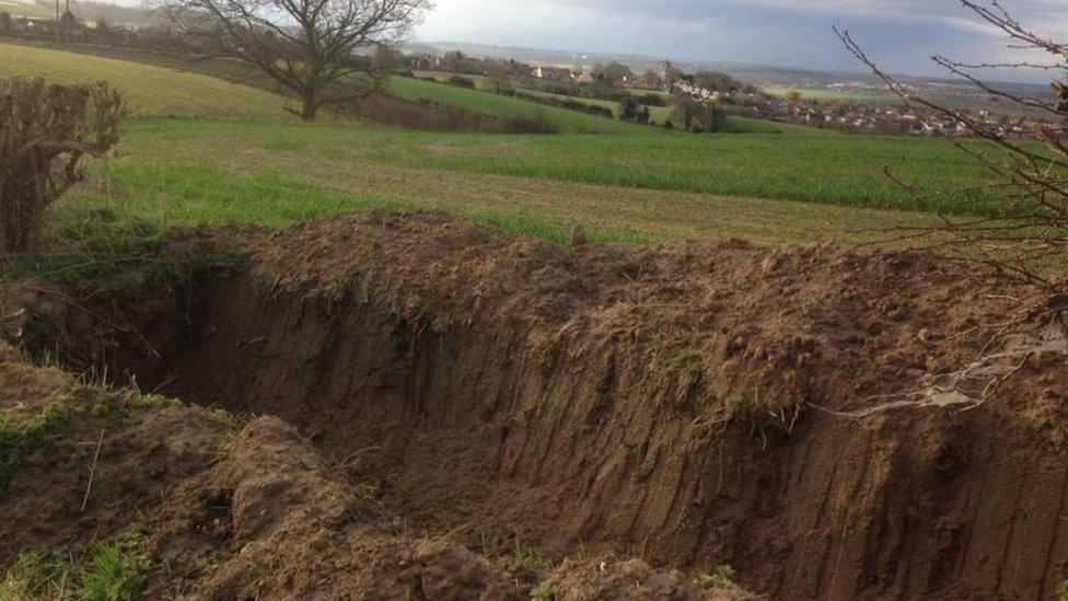 Trench dug at edge of field