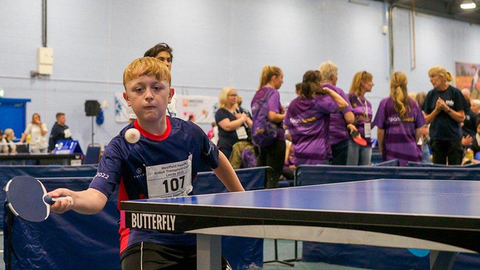 Boy playing ping pong