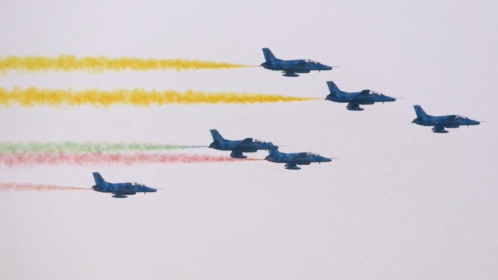 Chinese-made J8 trainers, used extensively in attacks on opposition villages, flying overhead at the parade