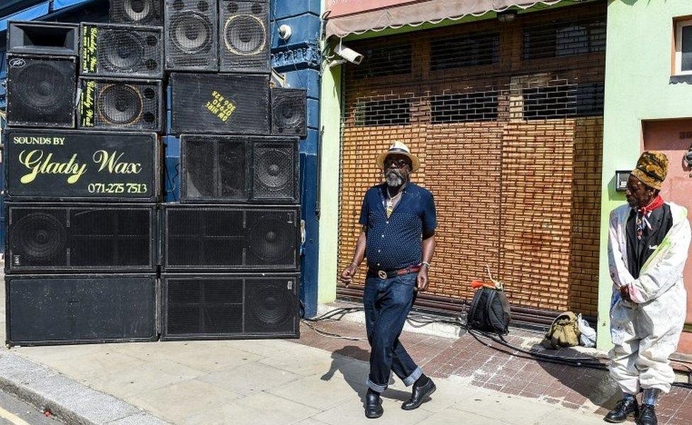 Man dancing to reggae music at sound system