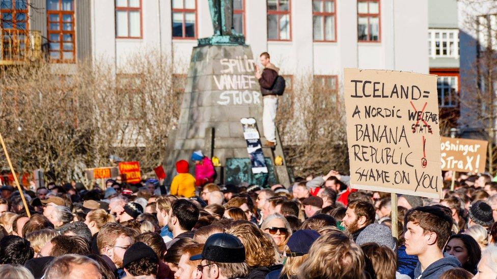 People gather during a protest on Austurvollur Square in front of the Icelandic Parliament in Reykjavic, Iceland, 04 April 2016