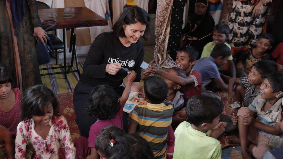 Jessie with children in the camps