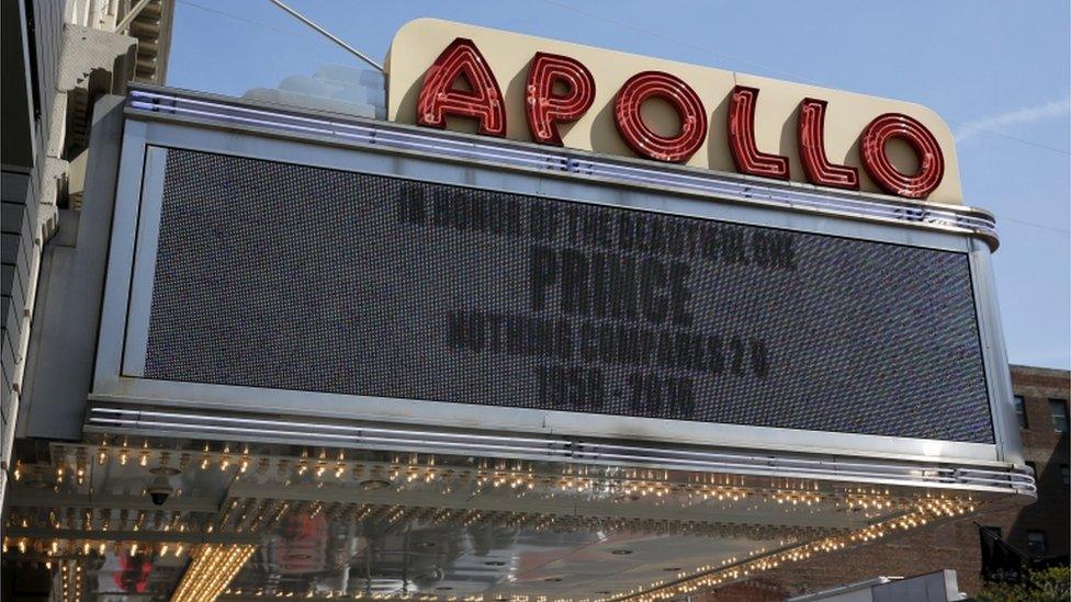 A sign at the Apollo Theatre in New York reads: "In honour of the beautiful one, Prince. Nothing compares 2U. 1958-2016"