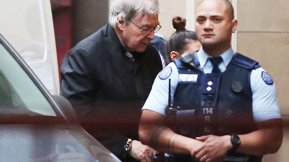 George Pell being led into court on Thursday