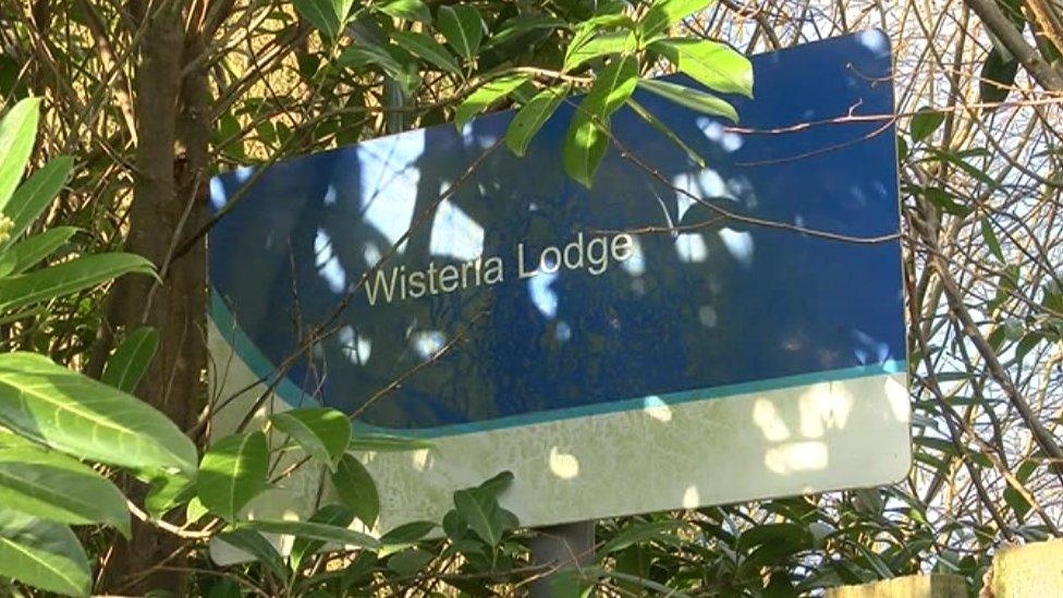 Wisteria Lodge sign