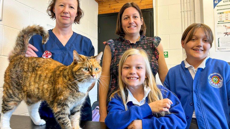 Minster Vets clinical director Sarah Ford, Tiger’s owner Rebecca and her two children two daughters Chloe, 10, and seven-year-old Charlotte