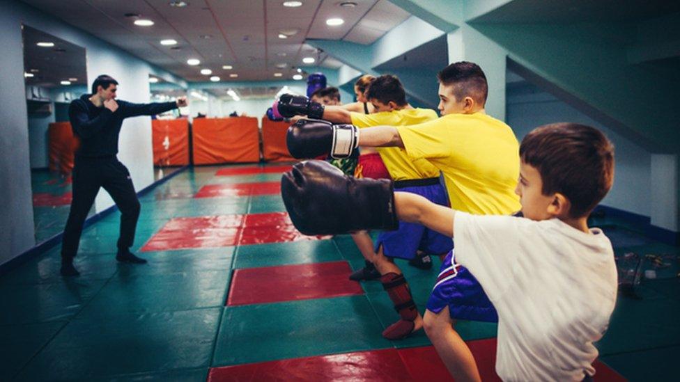 Young people boxing