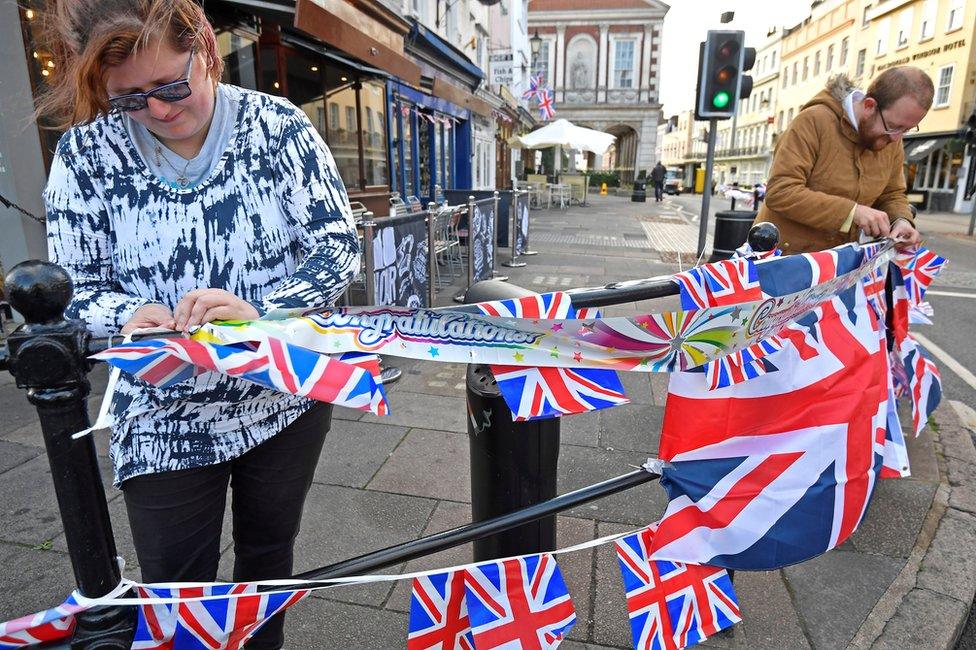 People string up bunting, on the day before the royal wedding of Britain's Princess Eugenie and Jack Brooksbank, in Windsor, Britain, October 11, 2018