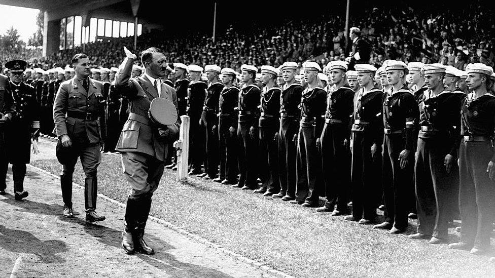 The Nazi leader inspects members of the Hitler Youth