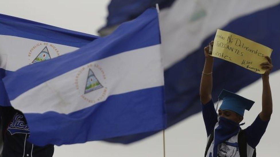 A person participates in a march calling for President Daniel Ortega to be ousted in Managua, Nicaragua, 23 July 2018