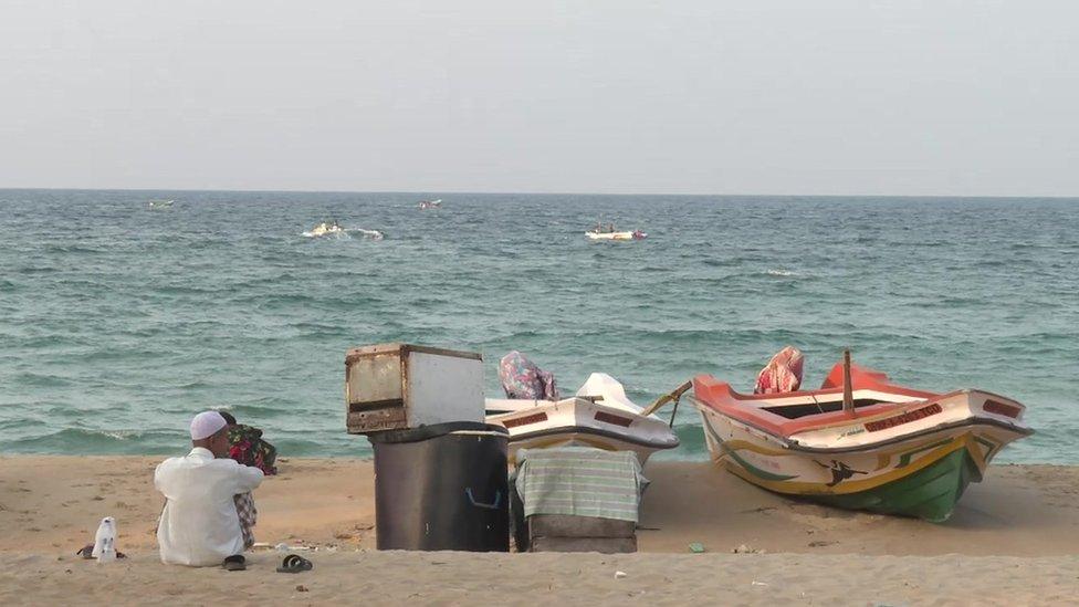 Fisherman sits on the beach in Kattankudy