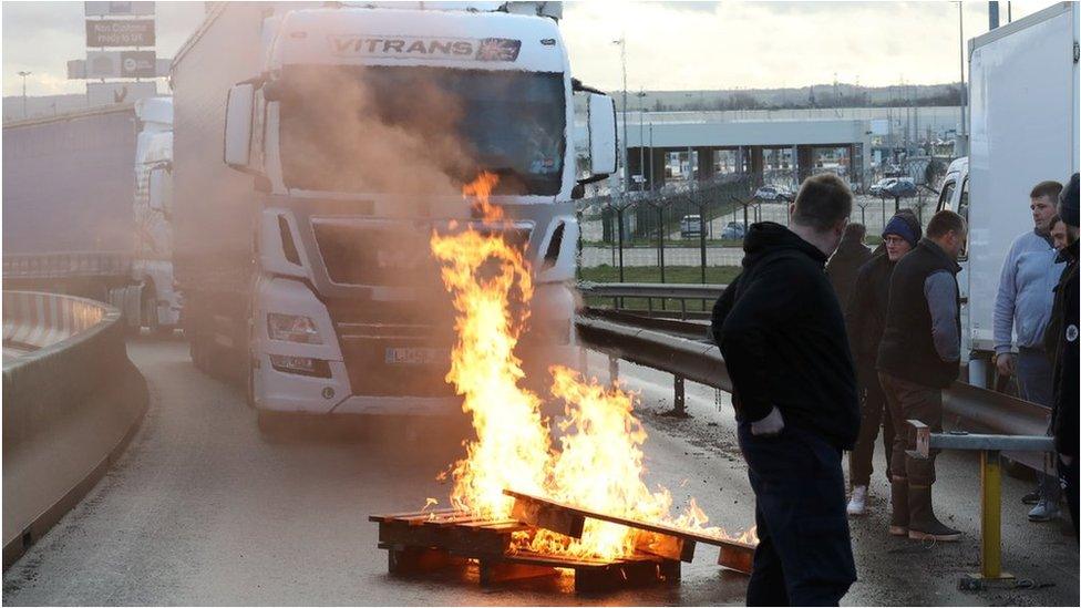 French fishermen block trucks at the Eurotunnel Freight Terminal