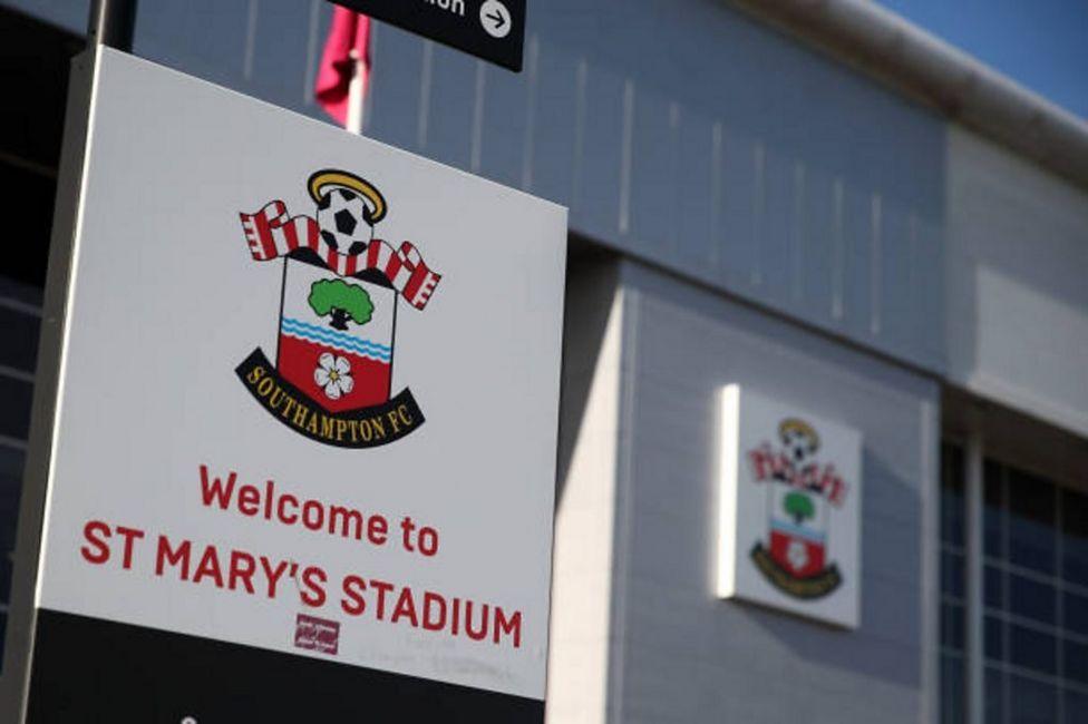 A welcome sign and facade of the Itchen Stand at St Mary's Stadium