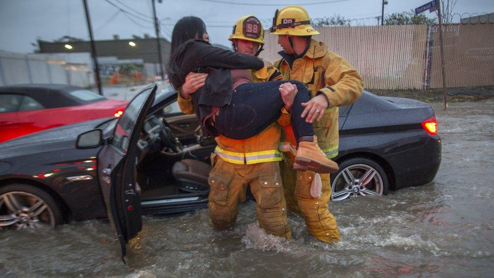 Firefighters save woman from her car